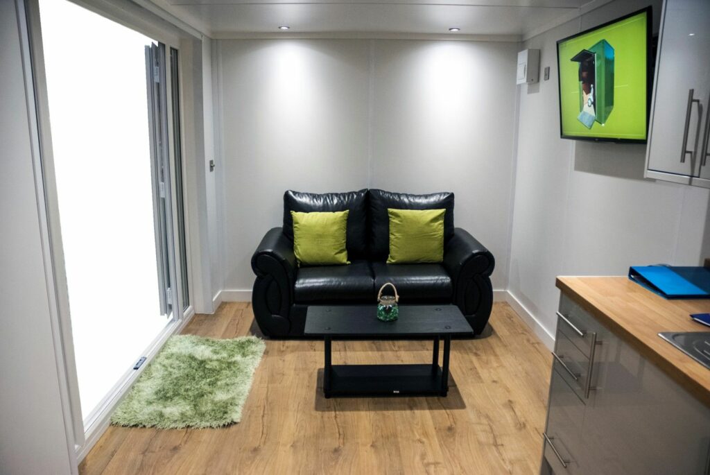 shipping container converted into man cave interior