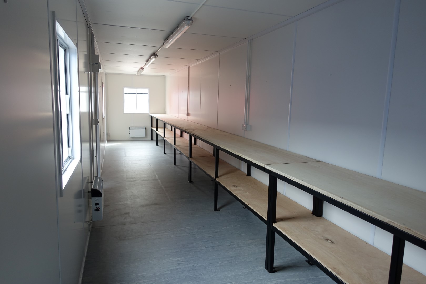 wooden shelves in a shipping container